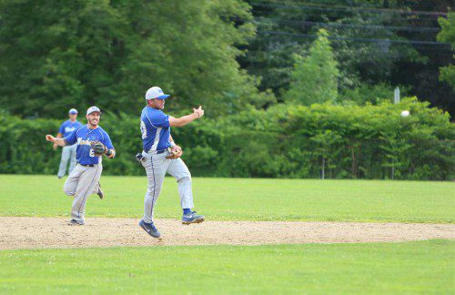 SHORTSTOP Scott Searles (right) had three hits and scored a run in the Merchants 9-4 triumph over the Somerville Thunder last night at Walsh Field. (Donna Larsson Photo)