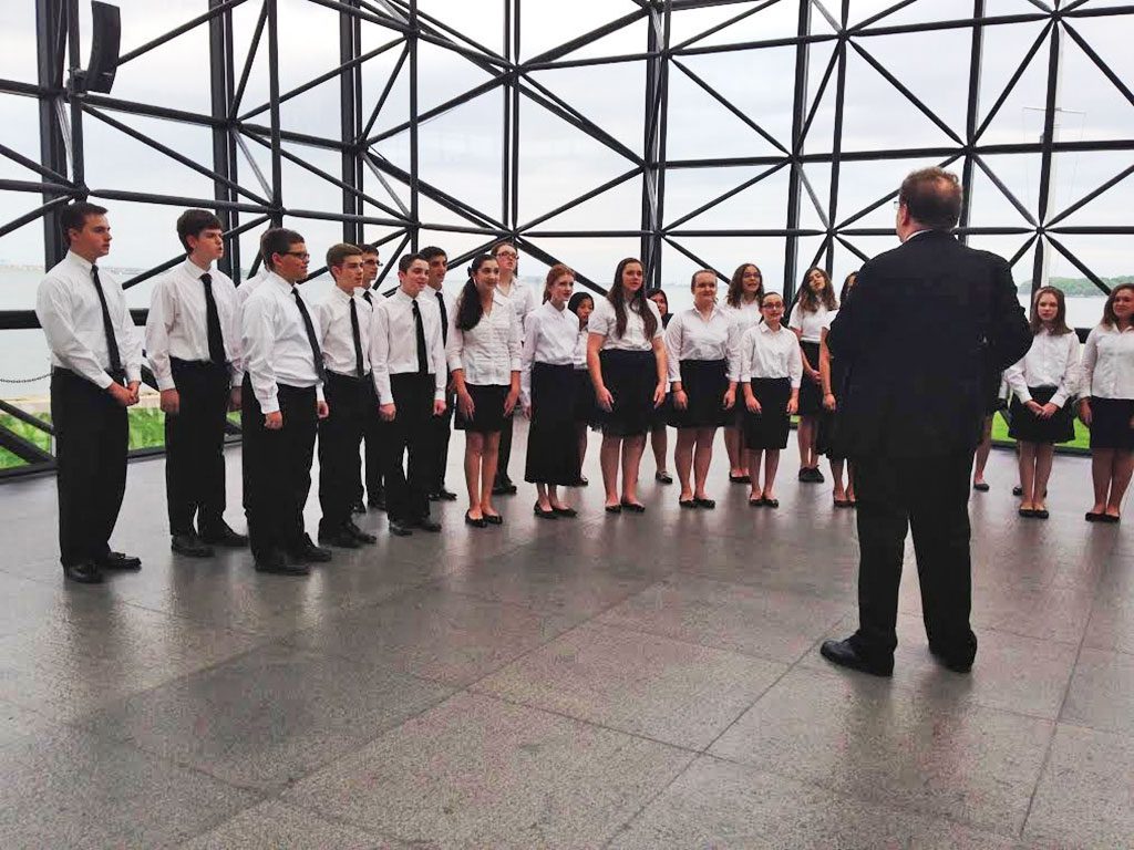 THE Pioneer Singers returned to Boston’s John F. Kennedy Presidential Library recently, giving a completely a cappella performance for visitors to the library’s massive glass pavilion. The performance featured selections from the group’s upcoming concert tour to Williamsburg, Va.