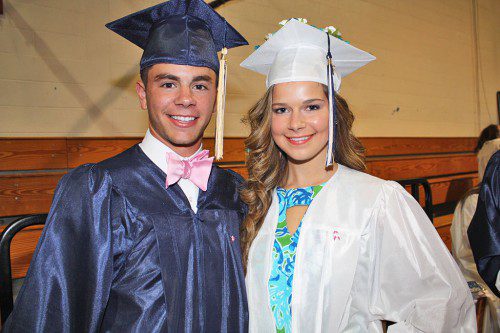 MARC BUDD, Grace Leman and all their classmates wore a pink ribbon pin with a white dove on their graduation gowns to honor the memory of classmate Gianna Dias, who died of cancer prior to her sophomore year. Budd wore a pink bow tie in her honor too. (Maureen Doherty Photo)