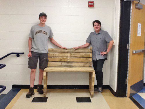 LHS JUNIORS Nick Miller (left) and Chris Bartolotta proudly display a bench they built out of pallets in Scott Gordon’s environmental science and sustainability college prep class. (Courtesy Photo)