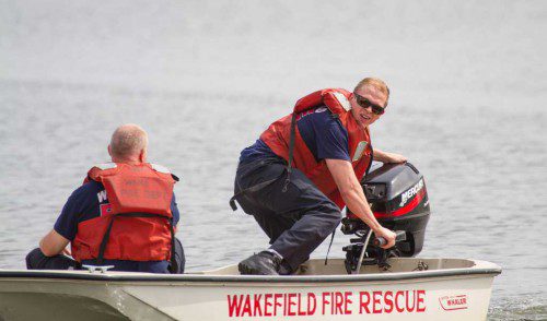 WAKEFIELD Firefighters Chris Crogan, left, and Tim Donovan are shown operating the department’s Boston Whaler at the rescue training session on Lake Quannapowitt. (Jonathan O’Brien Photo) 