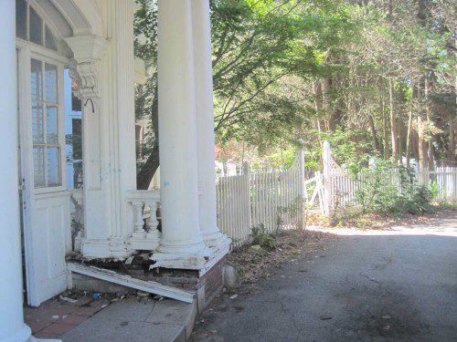 CRUMBLING columns are only the beginning of problems at the 10 Mansion Rd. mansion. In its heyday, the home was as magnificent as anything seen on “Downton Abbey.” (Gail Lowe Photo)