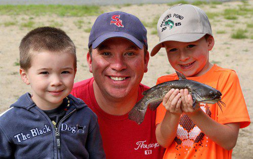 DANIEL, BRIAN AND BRENDAN TRENTSCH of North Reading had plenty to smile about at the Martins Pond Children's Fishing Derby. (Lori Lynes Photo)