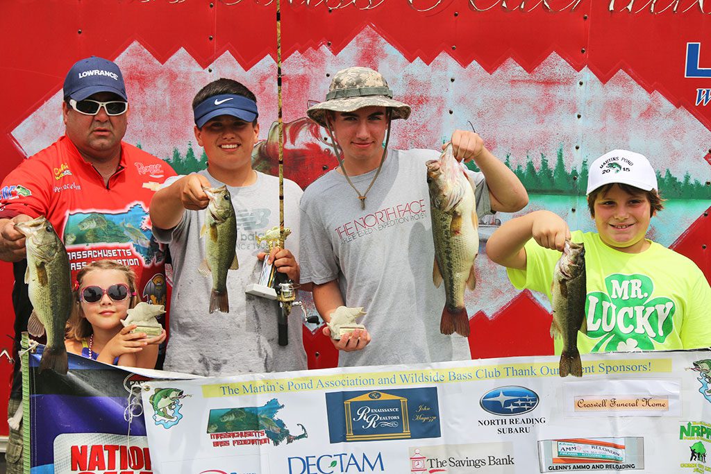 WINNERS of the 18th annual Martins Pond free children's fishing derby had a lot to show off this year. From left: Peter MacLellan from the Wildside Bass Club, Molly Kenny, Romano Duncan, John Gemmell and Owen Delano. Read more in today's sports. (Lori Lynes Photo)