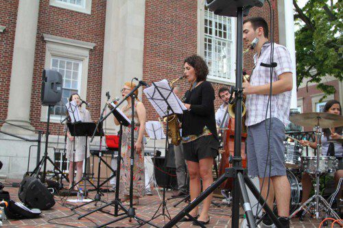 LAST THURSDAY, the Gaia Wilmer Octet performed in front of the Beebe Library. The Plaza Jazz series has become a summertime fixture downtown, with artists playing every Thursday night. (Donna Larsson Photo)