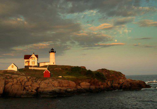WHILE VISITING his parents, Lennie Malvone was in York and took this picture of the Nubble Light at sunset with the moon rising behind it.