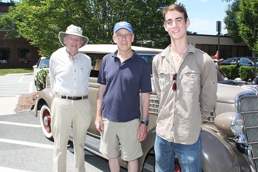 THE WILLS FAMILY, from left, Charlie, Richard and Adam show off Charlie's 1935 Ford Convertible Sedan during the Senior Center's annual Antique Car Show on June 25. Charlie has passed down his love of classic cars to both his son and grandson. (Dan Tomasello Photo)