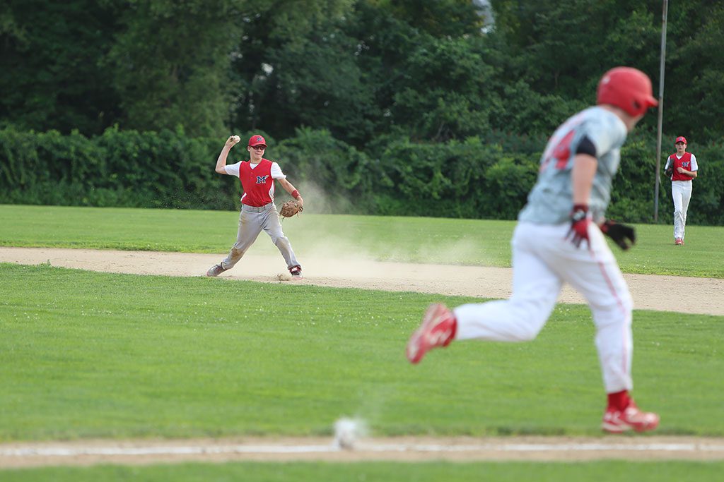 Melrose’s entry in the Lou Tompkins A division made the Tournament of Champions and posted a 13-8 record this summer. In the photo, Joe Stanton (right) makes the throw to first base as shortstop Sean Morrow (left) watches the play. (Donna Larsson Photo)