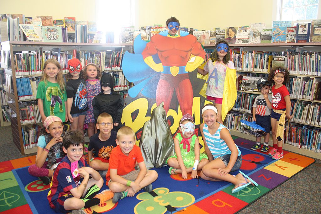 EVEN superheroes love a parade. Participants in the Summer Reading Program and their guests enjoyed an end-of the-summer celebration at the Lynnfield Public Library on Friday. In keeping with the program theme of "Every Hero Has a Story," the party included a costume parade through the library with the children dressed as their favorite superheroes. The 99 children enrolled logged a combined 1,678 hours of reading this summer and 40 won the grand prize of tickets to the Topsfield Fair with lunch and a ride.  (Maureen Doherty Photo)