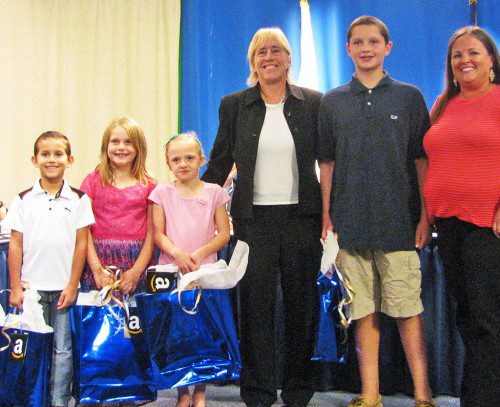 WINNERS OF THE School Department’s Summer Math Challenge received their prizes at Tuesday’s School Committee meeting. Joining School Superintendent Kim Smith and School Committee Chairman Kate Morgan are Math Challenge winners Galvin Middle School eighth-grader Willem Hendriks, Walton School third-grader Kayla Timas, Woodville School second-grader Isaac Melo, Greenwood School second-grader Alyson Graham and Dolbeare first-grader Alexandra Cannon.