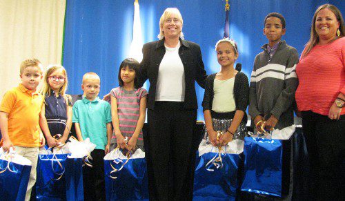 WINNERS OF THE School Department’s Summer Reading Challenge received their prizes at Tuesday’s School Committee meeting. Joining School Superintendent Kim Smith and School Committee Chairman Kate Morgan are Reading Challenge winners Dolbeare first-grader Charlie Richter, Greenwood first-grader Alexandra Baumhardt, Walton first-grader Taylor Miller, Woodville second-grader Serena Loh, Galvin Middle School fifth-grader MaKenzie McConnell and Wakefield Memorial High School ninth-grader Brian Mendes. (Mark Sardella Photos)