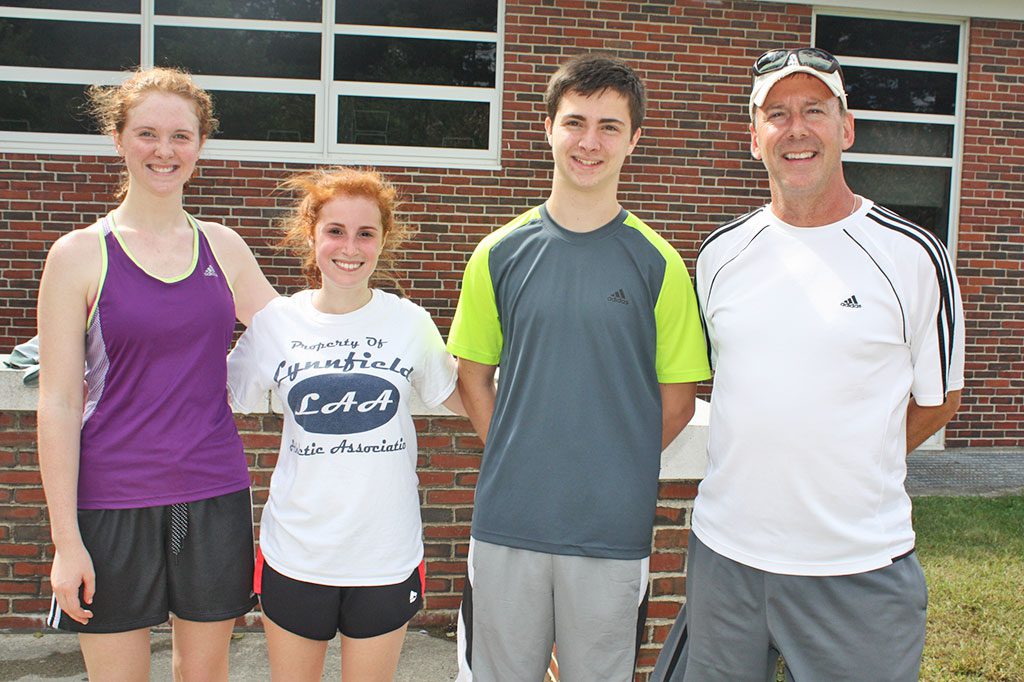 THE CROSS COUNTRY TEAMS will be led by, from left, senior captain Marie Norwood, senior captain Danielle Collins, senior captain Connor Reardon and head coach Joe DiBiase this fall. Missing from photo is senior captain Alex Dalelio. (Dan Tomasello Photo)