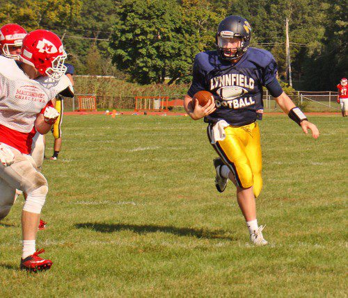 SENIOR quarterback Jake McHugh heads for the end zone on a five-yard touchdown run during the Pioneers’ scrimmage against Masco at Bunker Field in Boxford on Saturday, Aug. 29. (Tom Condardo Photo)