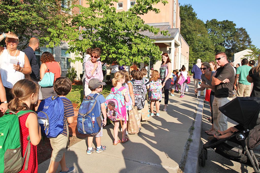 KINDERGARTNERS FILE into the Roosevelt School to begin their 2015-16 academic year. They are members of the Class of 2028. (Donna Larsson Photo) 