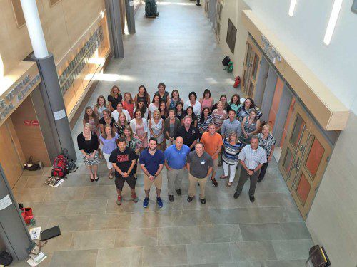 YESTERDAY THE Wakefield Public Schools had an orientation for those who are new staff members in 2015-16, which included remarks by Supt. of Schools Dr. Kim Smith (right, second row). The academic year begins a week from today. Among the 41 new educators are Patrick Hennessey, Craig Bekier, Connie Buntin, Caitlin Brighenti, Jennifer Beardslee, Keri Melanson, Joanna Doering, Sarah Wick, Michelle Tomcyzk, Erin Schermerhorn, Jennifer Aronson, Shawn Theriault, Chris Tolios, David Cellucci, Ann Whelan, Gina Passaro, Kiersten Atwater, Caitlin Lynch, Mark Miller, Jaryd Palmer, Anna DePina, Marianne Oshiro, Anne Miles, Carly Donelson, Ann Connolly, Jonathan Quint, Ronald Marino, Kristen Brazile, Patricia Doren, Jill Jenkinson, Ashley Lynch, Kellye Sheehy, Danielle Metzler, Julie Gilmartin, Amanda Betts, Katie Tenney, Meghan Leary, Rebecca Briano, Michelle Adams, Corine Keyes and Bethany Radabaugh. (Brian Robertson Photo)