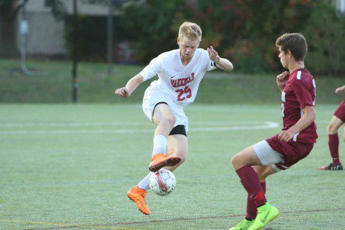 ANDREW AULD, a senior captain (#25), had a strong game at his defensive midfield position and also scored goal. (Donna Larsson Photo)