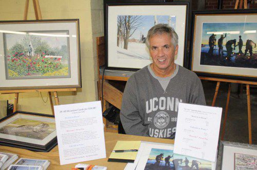 WAKEFIELD resident Tom Maguire displays the watercolor paintings he was selling at the fourth annual Artisan Affair at the Wakefield Item press room Oct. 17. (Dan Tomasello Photo)