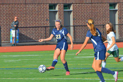 SENIOR CAPTAIN Abbie Weaver (23) searches for an open teammate during the Pioneers' 2-1 loss to North Reading Sept. 21. Weaver had an assist during the game. (John Friberg Photo)