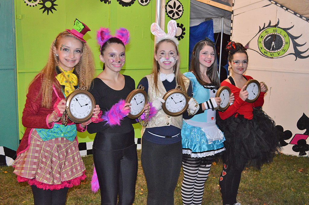YOUNGSTERS from The Dancing School starred in an Alice In Wonderland inspired dance as part of the Haunted Tours at the Martins Pond Haunted Playground prior to Halloween. From left: Lizzie Barrett, Sheila Barrett, Lauren Anderson, Angelina Nicolo and Julia Zackular know the witching hour is approaching. (Chris Butler Photo)