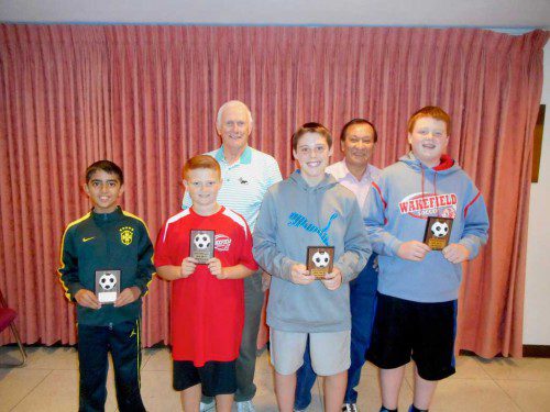 KNIGHT OF COLUMBUS Soccer Challenge winners with their plaques. In the front row (L to R) are Yehya Zeineddine, William Townshend, Logan Cosgrove and Liam Cosgrove. In the back row (L to R) are K of C soccer chairman, Bob Curran, and Grand Knight Vinny Gonzales