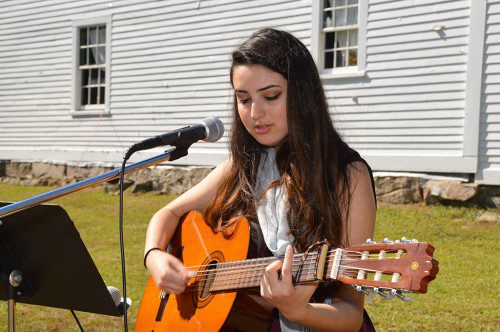 AUSTIN PREP SENIOR Lena Syed entertained at the Apple Festival for the second year, delighting fair goers with her vocals and guitar playing. (Bob Turosz Photo)