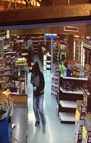A SURVEILLANCE CAMERA captured this image of the suspect who robbed S & M Liquors on Water Street last night.