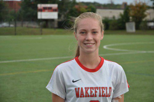 CHRISTOPHER J. BARRETT Realtors would like to congratulate Kelsey Czarnota for being named Wakefield Memorial High School Varsity Girls’ Soccer Player of the Week. Kelsey is a junior and a third year varsity player. She was a major factor in the 3-1 win over Watertown and the 2-2 tie against Burlington. Kelsey came into the season late off an injury. Being the natural athlete that she is, she has been able to move back into play with force, determination and the physical fitness that is innate to her. She is able to play a few positions but came on particularly strong last week as Wakefield’s left midfielder. Kelsey never missed a beat on defense, sprinting back on recovery and played as a smart defender, always containing, never lunging and tackling on opportunity. Offensively she keeps Wakefield’s play wide with fast and effective runs down the sideline. Kelsey is always available to her teammates as an option for a pass. She finds space to play the ball and is able to connect with open teammates around her. Creativity in offensive possession is a distinct skill that she embodies. Her presence and participation is heard and felt by all those around her and she is a major reason for her team meeting with success last week. 