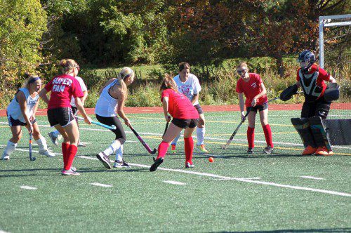 THE WMHS field hockey team recently held its alumni game at Beasley Field on Oct. 11. Past and present Warrior players were pitted against each other in a competitive contest. There is heavy action in front of the alumni net.