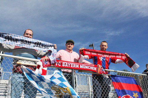 F.C. BAYERN Munchen fan club members (l-r): Peter Manson, Dave Cannata and Armin Dzanic cheer on the German players at Pioneer Stadium. Saturday. (Maureen Doherty Photo)