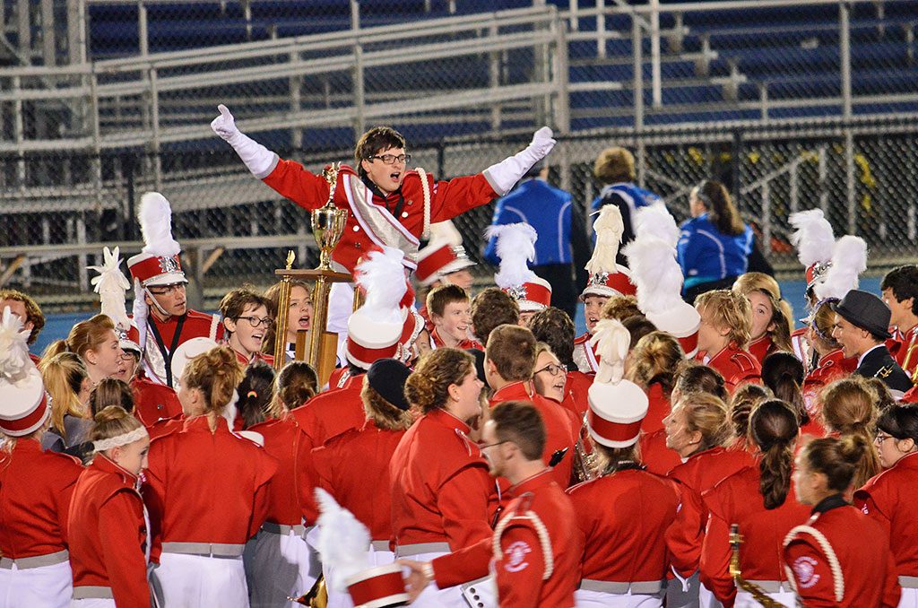 AFTER THE Warrior Marching Band and Color Guard finished its performance last weekend, members celebrated their gold medal at midfield in the New England Marching Band Championships held in Lawrence. (Elizabeth Lowry Photos)