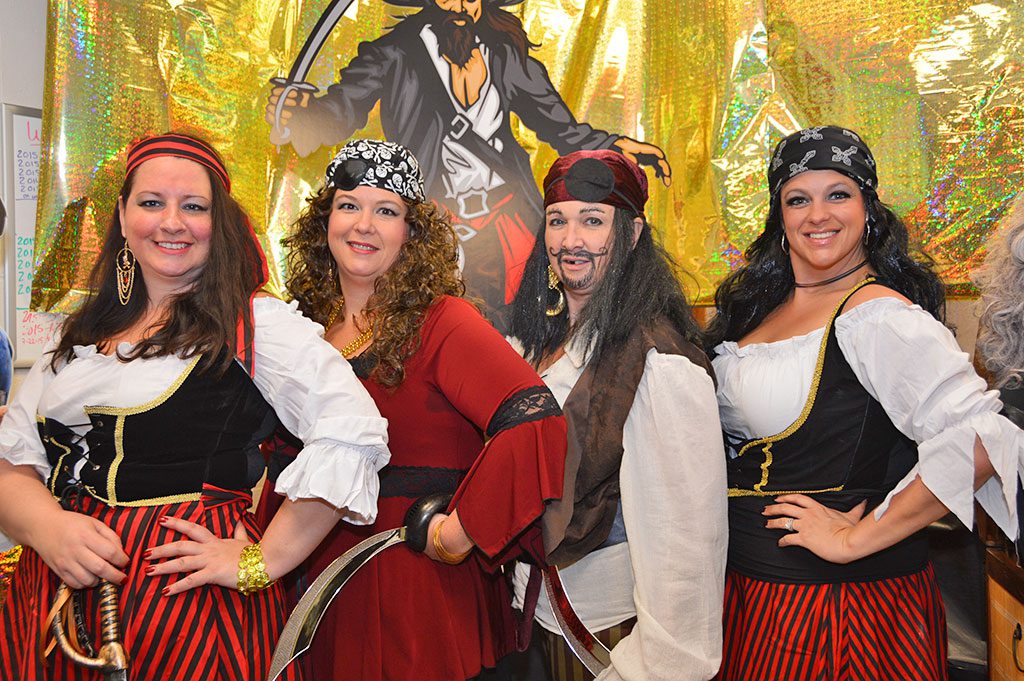 THE FINANCIAL DEPARTMENT in town hall adopted a Pirates of the Caribbean theme for this year’s Halloween decorations, striking fear into customers come to pay their bills. From left: Monica Schiavoni, Amy DiChiara, Sherri Greer and Jessie O’Brien. All the decorations were done on the employees’ own time. (Bob Turosz Photo)