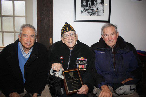 HONORING all who answered the call to duty. WWII U.S. Navy veteran Tony Grasso, 89, (center), past Commander of the Lynnfield American Legion Post 131 from 1992 to 2003, was presented a commemorative plaque in honor of his service to Post 131 at Veterans' Day services. He served in the Pacific for two years and was on the USS Missouri for the signing of the surrender treaty by the Japanese on Sept. 2, 1945. He is flanked by his brothers, Pat Grasso (left), a U.S. Army veteran who served during the occupation of Japan in 1946, and Charles Grasso, who served during the combat period of the Korean War in 1952-53. Missing from photo is their brother Emilio. (Maureen Doherty Photo) 