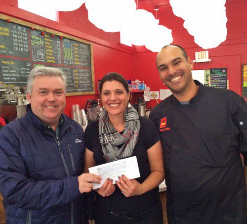 MAYOR Rob Dolan accepts a donation for the Emergency Fund from Coffee Tea and Me and La Qchara owners Emily and Lorenzo Tenreiro this week, bringing the total donations to over $13,000. (Courtesy Photo)