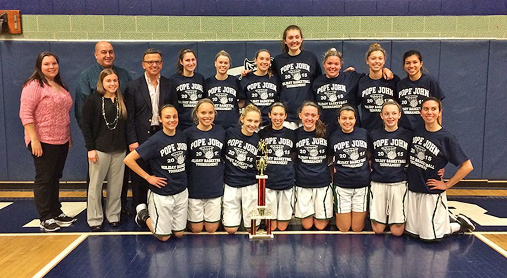 THE NRHS GIRLS' VARSITY Basketball team and their coaches are all smiles posing with the championship trophy after winning the 2015 Pope John XXIII Holiday Basketball Tournament. The team defeated the Winthrop Vikings and the Lowell Red Raiders to take home the trophy. (Courtesy Photo)