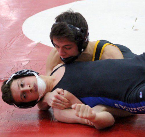 SENIOR CAPTAIN Max Whyman (on top) was crowned champion of the 132 lbs. weight class in the Anthony Lisitano Tournament at Wakefield Memorial High School Dec. 19. He finished second in the Lisitano Tournament in 2013 and third in 2014. (Courtesy Photo)