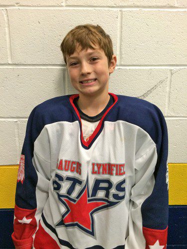 YOUNGSTER Ben Mullin survived a bone crushing hit to score both goals for the Pee Wee AA team to preserve a tie for the Stars against Melrose. (Courtesy Photo) 