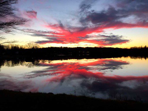 THIS SPECTACULAR sunset on Lake Quannapowitt was captured by Tom Russo.