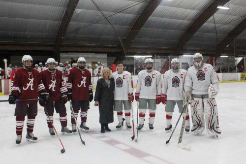 THE WMHS boys’ hockey team had its home opener last night at the Kasabuski Arena. Claudia Miksen (center), the daugher of former assistant hockey coach and teacher Bob Miksen, drops the puck to begin the season. To the left of her are the Arlington captains. On the right are Wakefield captains Anthony Funicella, Dylan Melanson, Steve Marino and Ben Yandell. 