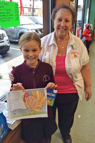 Catherine Crane, 8 (with The Farmland’s Connie Cooney), was a winner in this year’s Thanksgiving Turkey Coloring Contest sponsored by The Farmland.