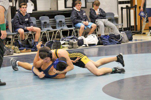SENIOR Devin Leggett (on top) pinned his 160 lb. opponent in 1:47 during the Black and Gold’s 46-24 victory over Peabody Jan. 22. Leggett, a first year senior, won his four matches last week and has an overall record of 25-5 this season. (Courtesy Photo) 