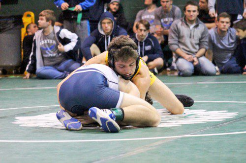 SENIOR CAPTAIN Max Whyman was crowned champion of the 132 lb. weight class during the Pentucket Holiday Tournament Dec. 28. The final round proved to be an historic moment for Whyman, as he earned his 100th career victory. (Courtesy Photo)