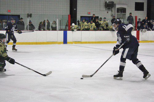 FRESHMAN Jagger Benson (11) scored two goals during the Pioneers’ 6-1 victory over Amesbury Jan. 16. (Dan Tomasello Photo)