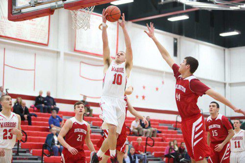 TIGHE BECK, a senior forward (#10), recorded 15 points and had many rebounds including three offensive boards in the third quarter alone in Wakefield’s 58-49 victory over Watertown on Friday night at the Charbonneau Field House. (Donna Larsson File Photo)
