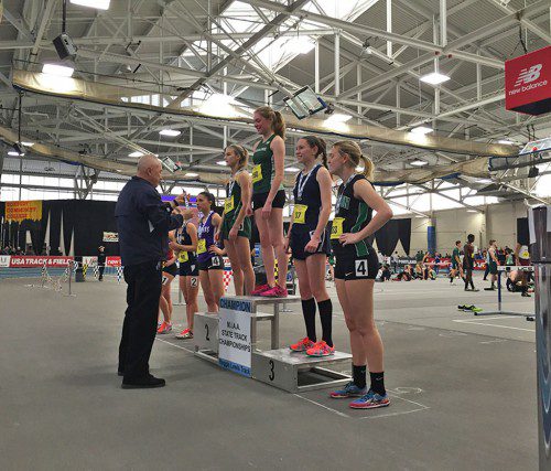 PROUD MOMENT. Kate Mitchell (second from right) is all smiles after receiving her third place medal in the 600m race at the Div. 5 State Championships. (Courtesy Photo)