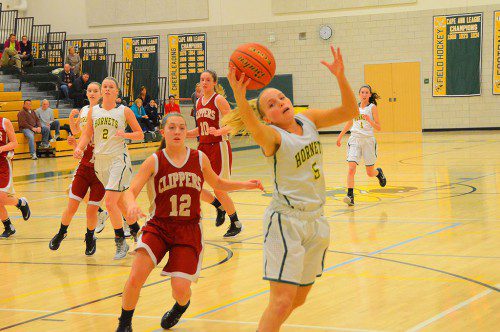 SENIOR KATIE WELCH makes a great play to keep the ball from going out of bounds late in the game against Newburyport. (John Friberg Photo) 