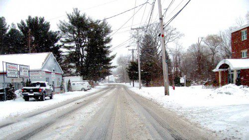PRE-TREATING by the DPW helped to keep snow accumulations down on roads like Lowell Street even at the height of the storm yesterday. (Mark Sardella Photo)
