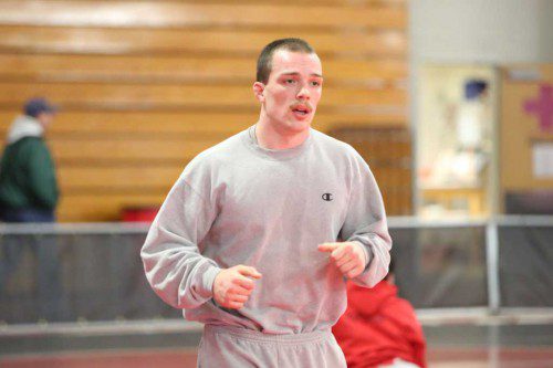 SENIOR CAPTAIN Evan Gourville warms up before competing at the 170 weight class in the All-State Meet which was held on Friday and Saturday at Reading High School. Gourville took fifth overall. (Donna Larsson Photo)