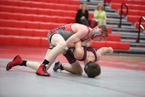 JACK SPICER, a junior (left), won the title at the 113 weight class with a 3-0 record on Saturday in the Middlesex League Wrestling Tournament which was held at the Charbonneau Field House. (Donna Larsson File Photo)