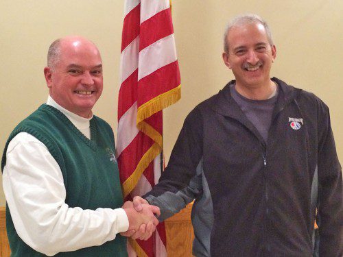 NORTH READING TO HOST. North Reading Little League president Eddie Madden (left) is congratulated by Massachusetts Little League Board member John Berardi following the announcement that North Reading had been awarded the 2017 State Championships. The event will bring Massachusetts' top 12–year–old all-star baseball teams to Benevento Memorial Fields next July. (Courtesy Photo)
