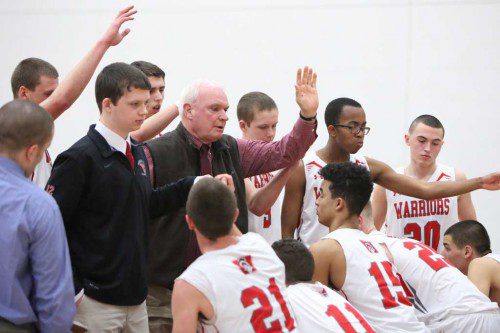 THE WARRIOR boys’ basketball team is hoping to high five each other after a win in tonight’s Div. 2 North tournament game against Beverly. The first round matchup will be played at Beverly High School. (Donna Larsson File Photo)
